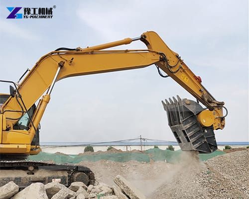 excavator crusher attachment at demolition construction site